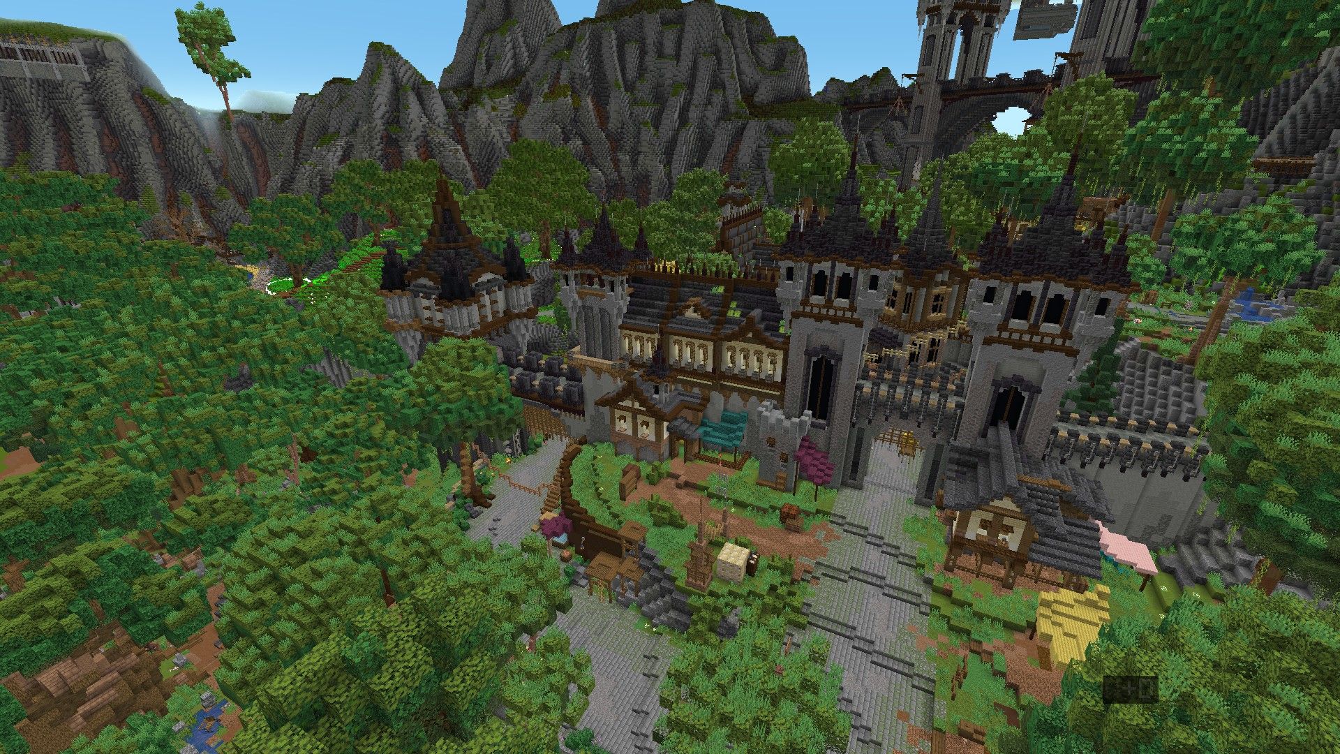 Medieval village tucked into a forested mountain valley